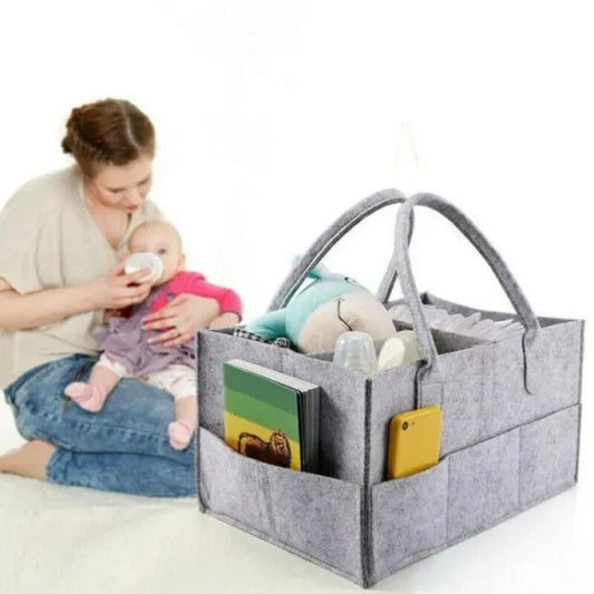 Compact and convenient diaper organizer for babies, designed for easy storage and portabiliity in the nursery.